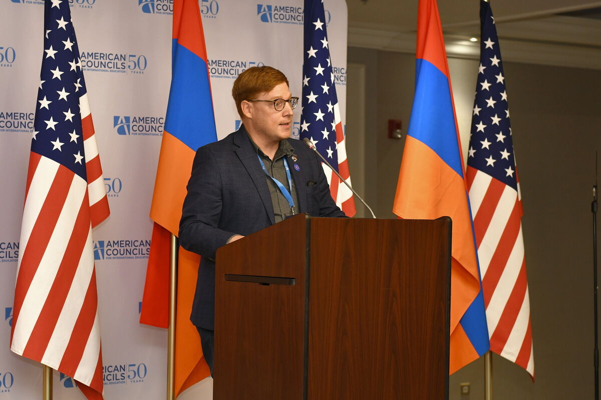 Dagen Valentine speaking at the USG Alumni Summit in Armenia